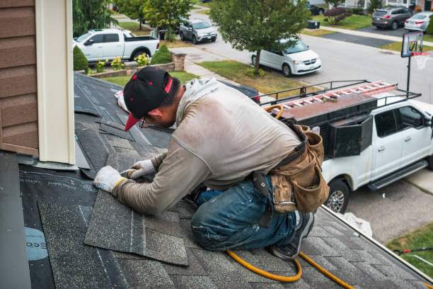 Professional Roofing technician working in Freedom, PA